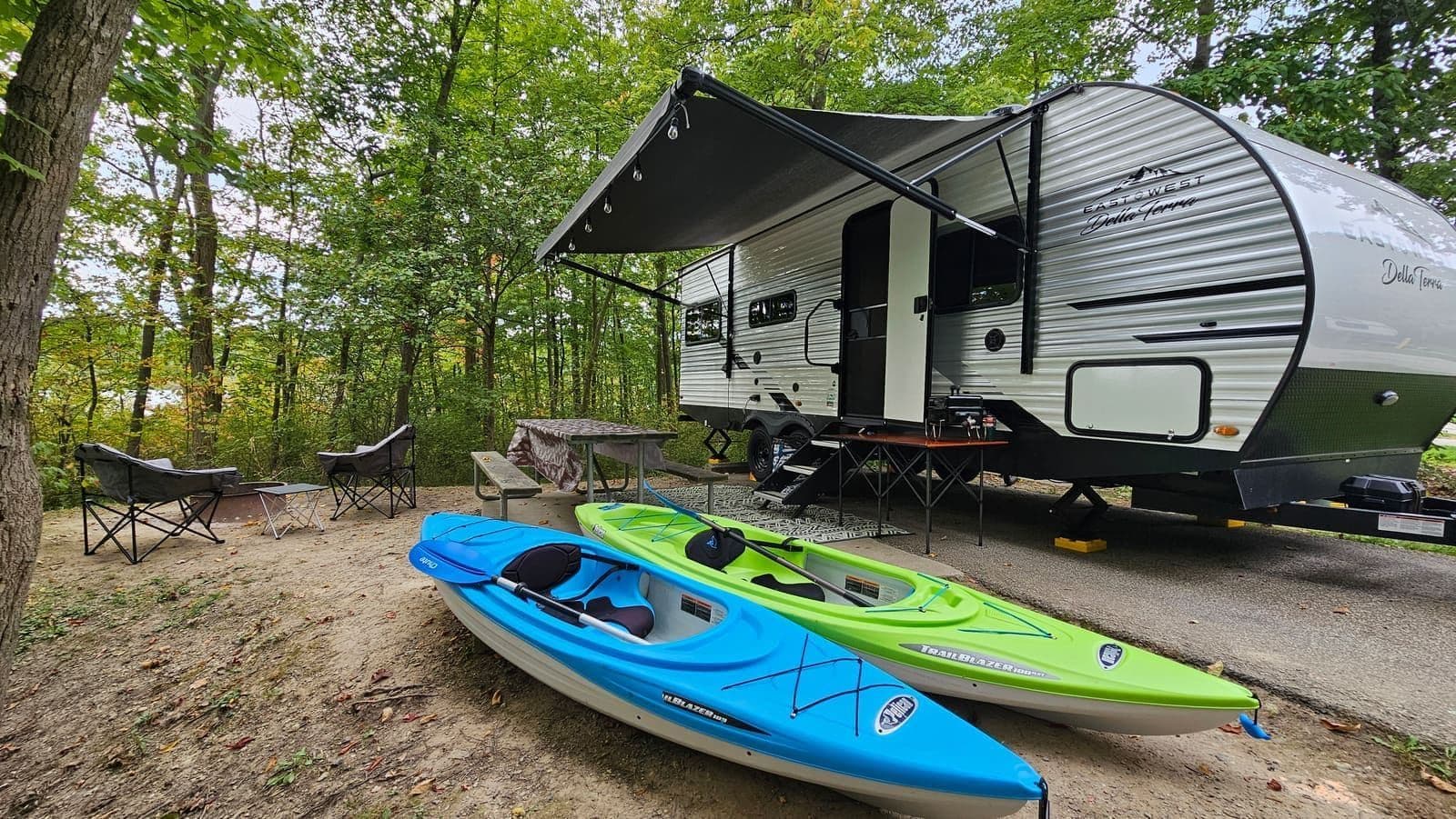 Wanderous camper set up at a campsite with outdoor add-ons