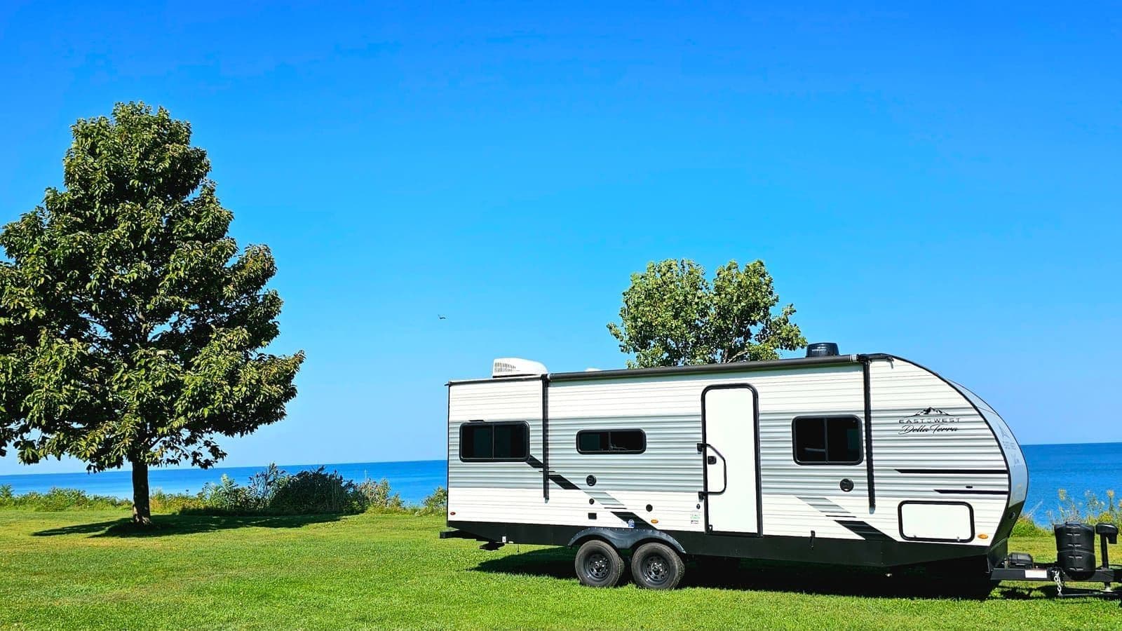 Wanderous travel trailer delivered and set up at a beachside campsite